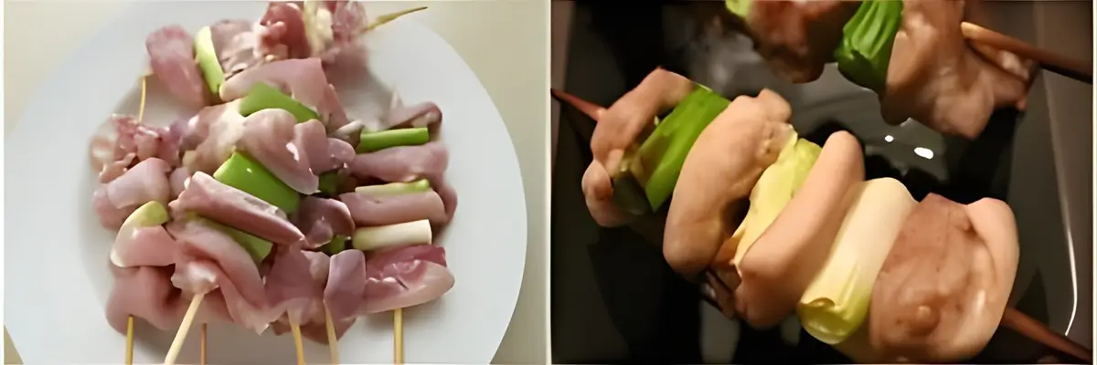 Raw chicken pieces and spring onions threaded onto bamboo skewers before cooking.