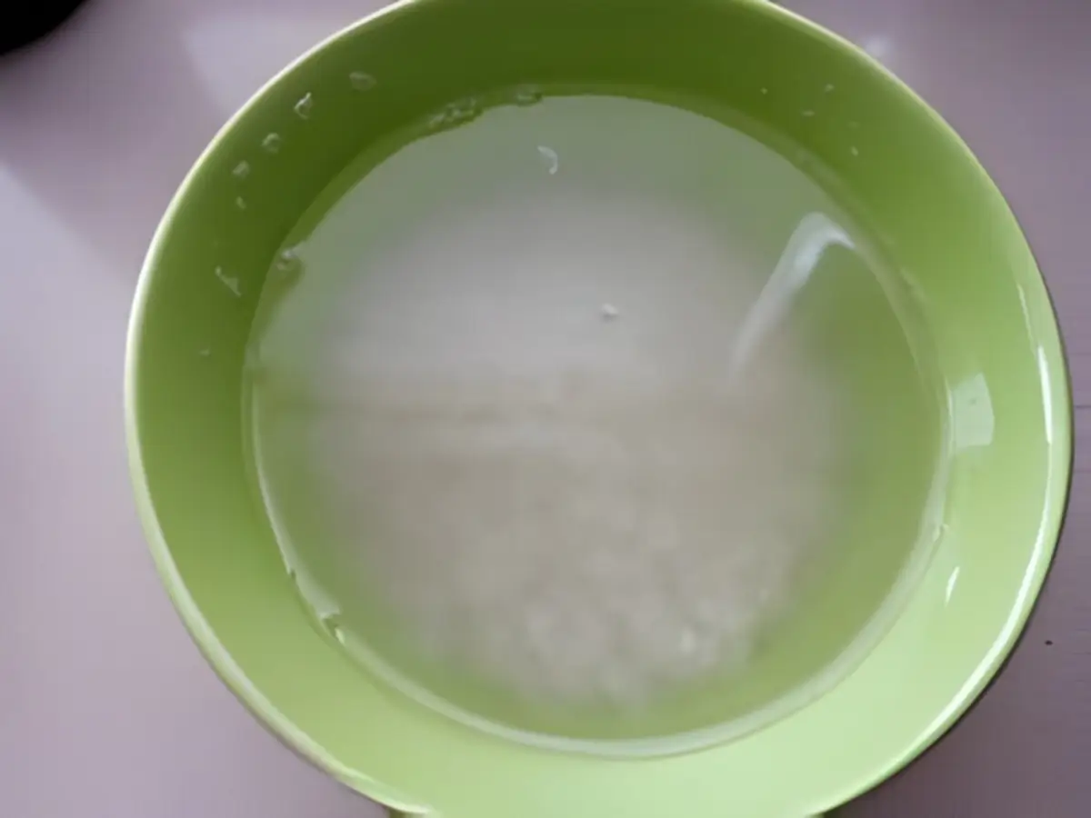 Washing Korean short grain rice in water.