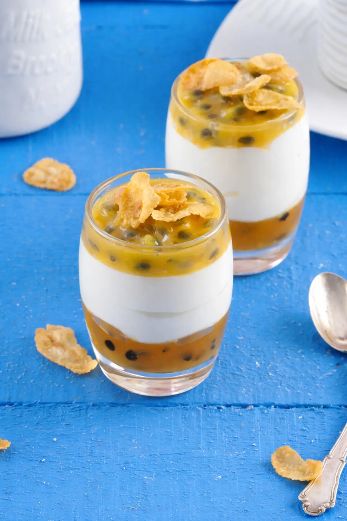 Yoghurt layered over fruit jam in a glass, creating a clear contrast between layers.