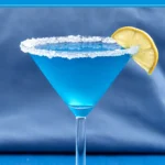 Glacier Fusion Cocktail served in a sugar-rimmed Martini glass with a lemon slice garnish.