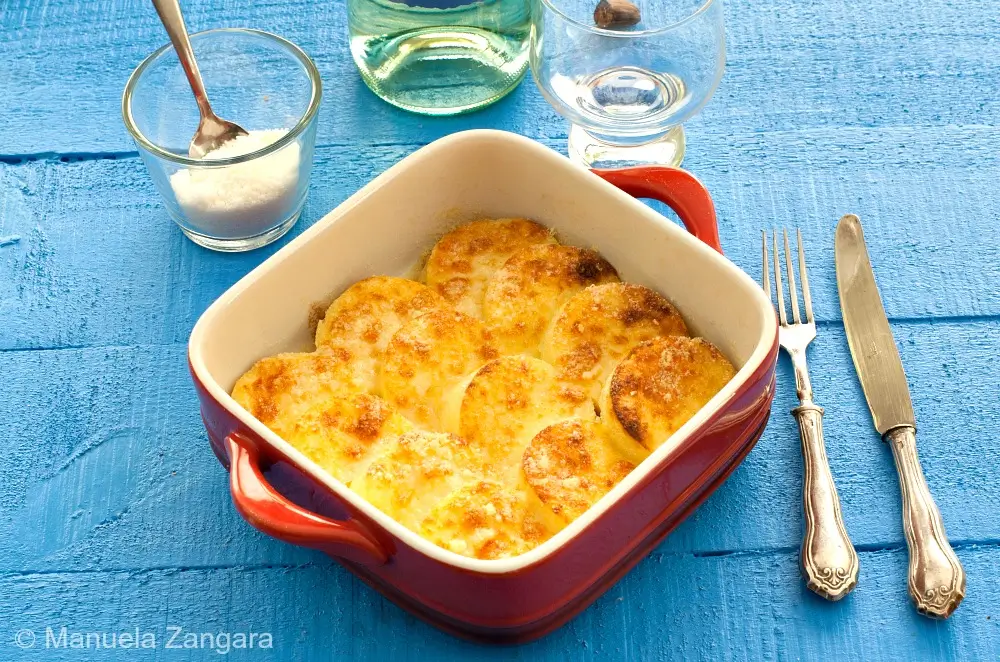 Freshly baked gnocchi alla Romana in a serving dish,