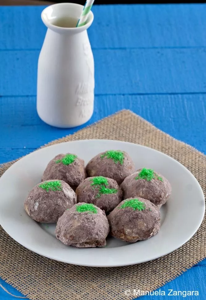 Single "Frozen" troll cookie with cocoa sugar coating and bright green sugar moss topping.