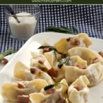 Plate of Casoncelli alla Bergamasca topped with crisp pancetta and sage butter sauce.