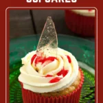 Broken glass Halloween cupcake with shard and red syrup on a glass plate.
