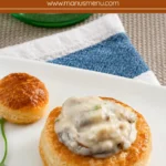 Mushroom Vol au Vents served on a white plate with parsley garnish.