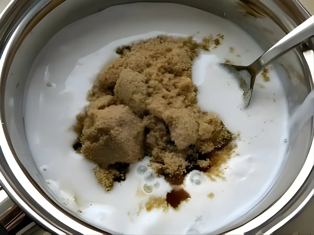 Coconut milk, brown sugar, and salt in a saucepan before cooking.