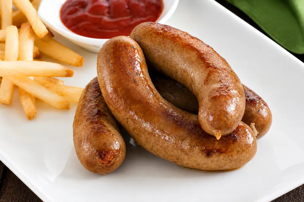 Golden brown Mozzarella Sausage with Sun Dried Tomatoes served with chips and tomato sauce.