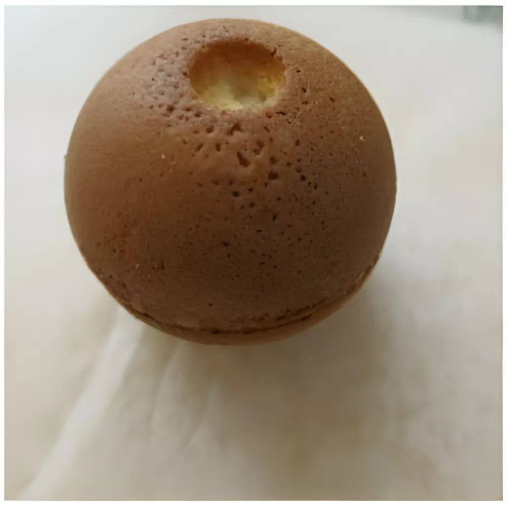 Half-sphere yogurt cake baked for the yarn ball base of the Playful Kitten Cake.