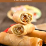 Close-up of chicken spring rolls with savoury vegetable filling.