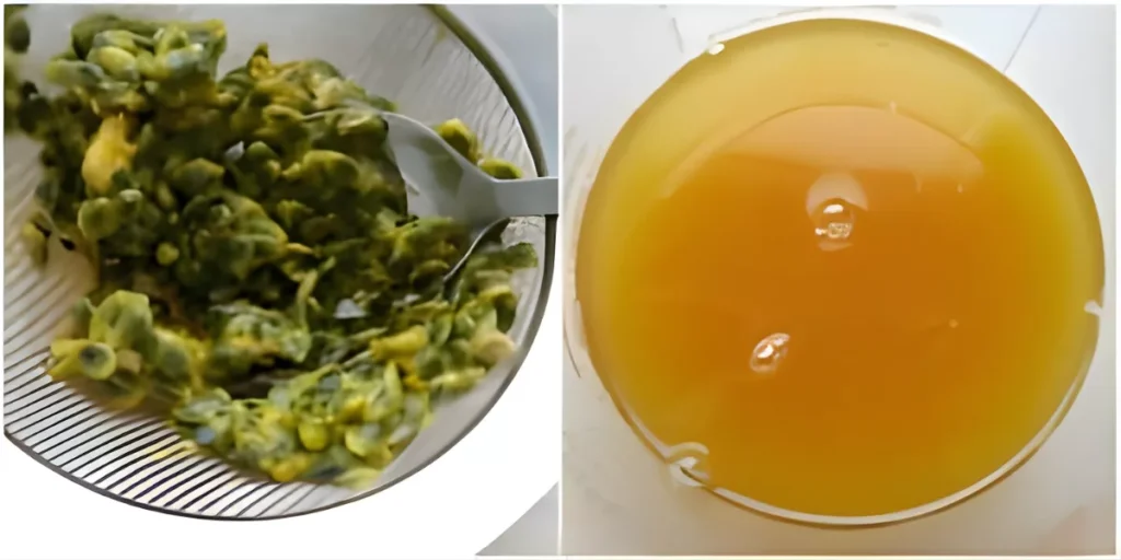 Straining passion fruit pulp with a spoon to extract juice.