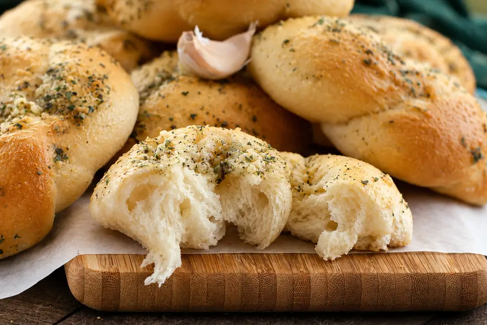 Soft pull-apart centre of a warm garlic knot.