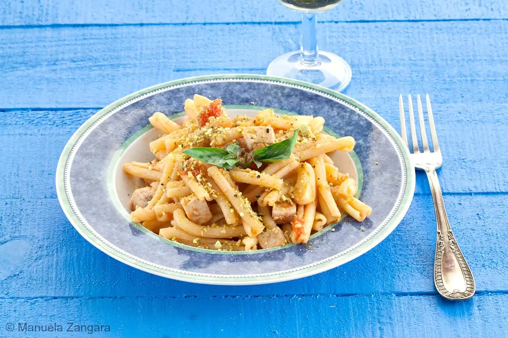 Swordfish and pistachio pasta topped with fresh basil.