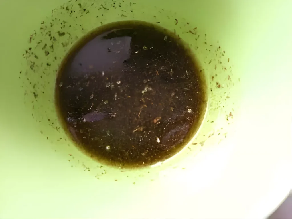 Bowl with za’atar and olive oil mixture used to top the Lebanese flatbread before baking.