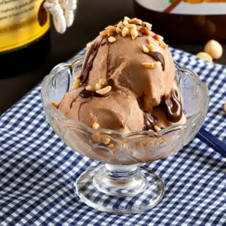 Creamy Frangelico gelato served with Nutella drizzle and crushed hazelnuts.