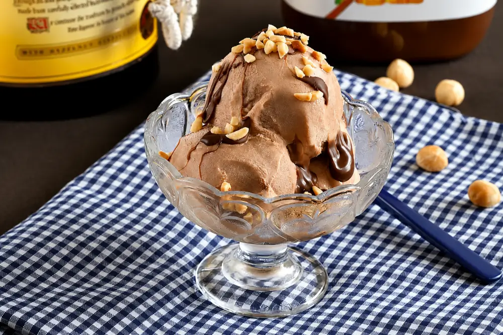 Creamy Frangelico gelato served with Nutella drizzle and crushed hazelnuts.