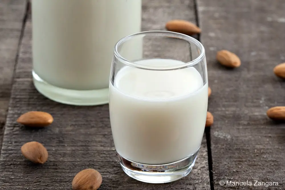 Close-up of Sicilian Almond Milk in a glass after straining.