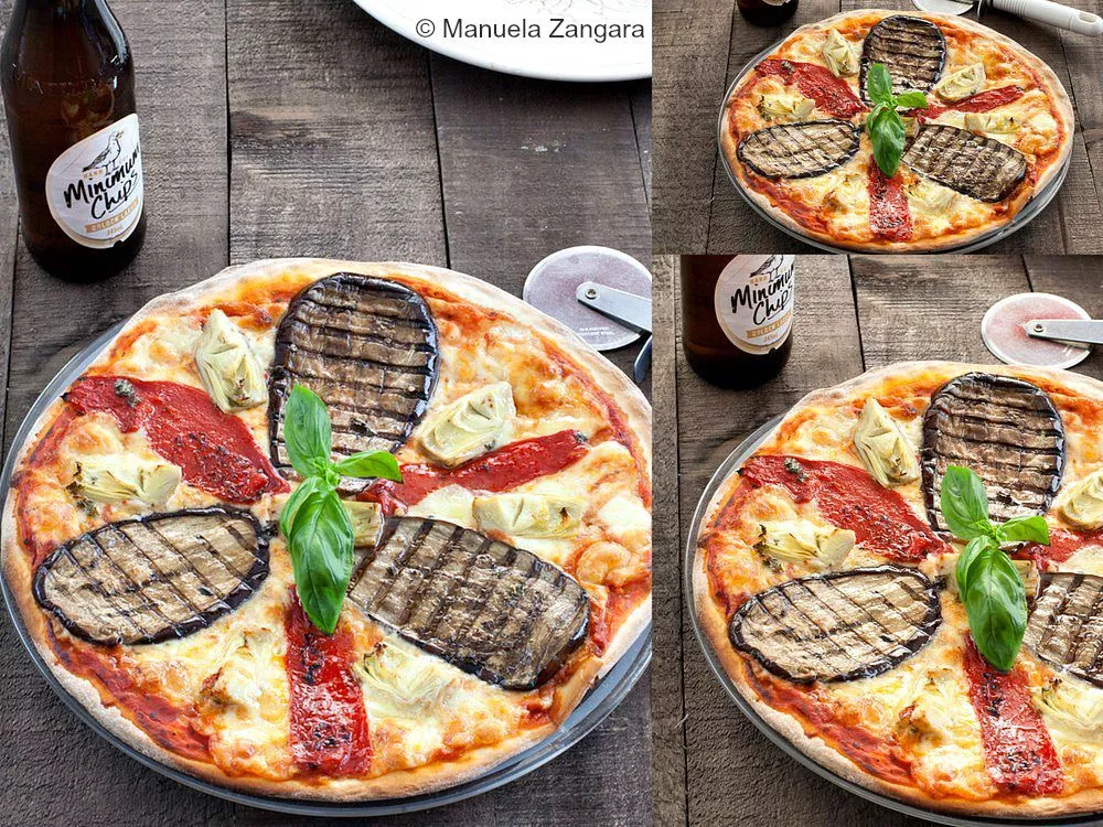 A fully baked Pizza Ortolana served with fresh basil, roasted vegetables, mozzarella, and a cold drink on the side.