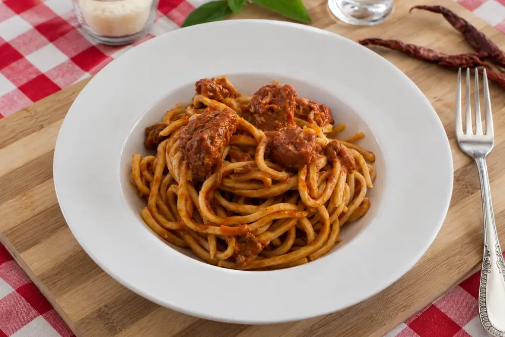 Fresh Troccoli pasta coated in rich pork ragù with tender pieces of slow-simmered pork.