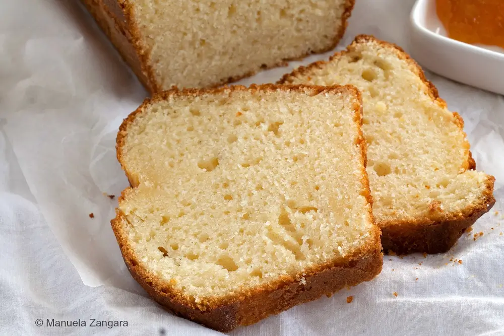 Slices of yogurt plumcake arranged on a cloth.