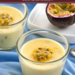 Chilled cream possets topped with passion fruit pulp beside fresh passion fruit halves.
