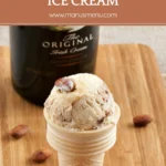 Scoop of Baileys Chocolate and Salted Almond Ice Cream in a waffle cone with roasted almonds on top.