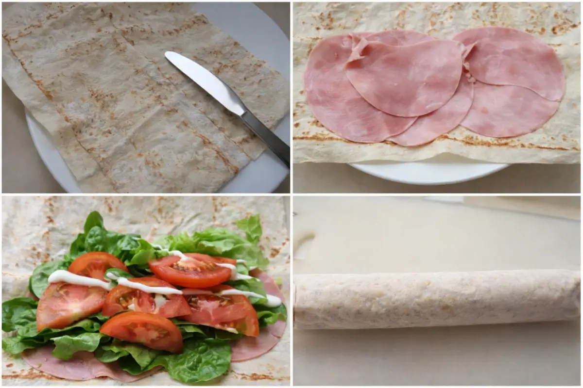 Ham wrap being assembled with mayonnaise, sliced ham, lettuce, and tomato before rolling.
