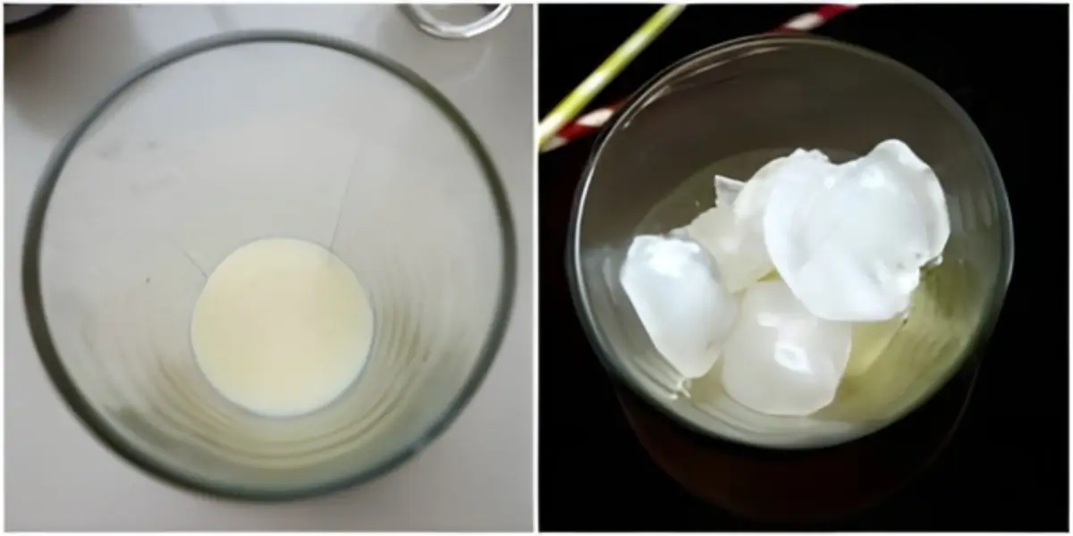 Sweetened condensed milk in a glass followed by ice added for Vietnamese iced coffee.