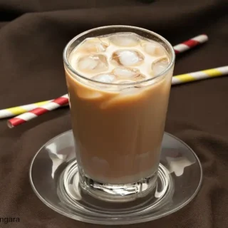 Vietnamese iced coffee mixed with ice and condensed milk served in a glass.
