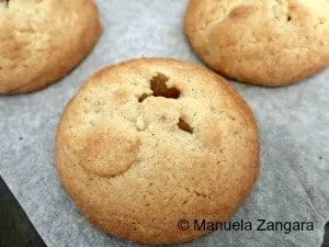 Freshly baked Apple Filled Cookies cooling on baking paper after baking.