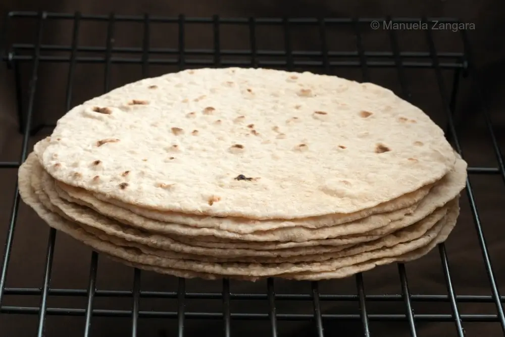 A stack of soft wholemeal chapatis.