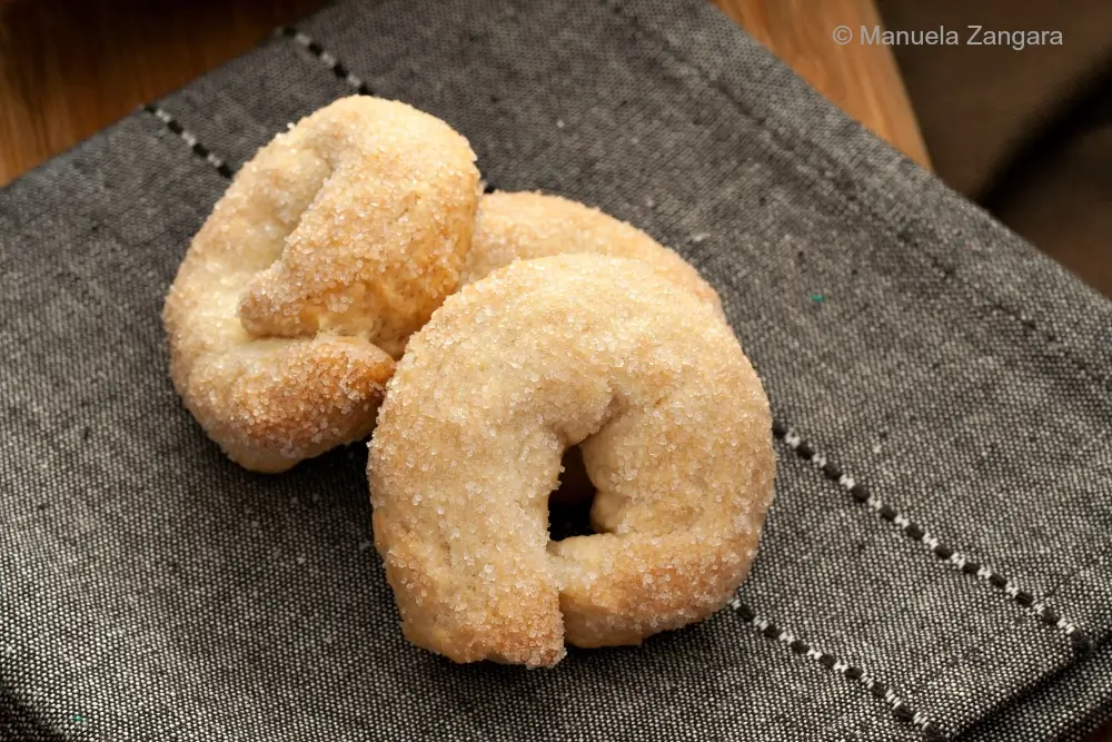 Close-up of sugar-coated Sweet Taralli on a napkin.