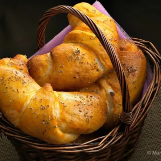 Golden savoury croissants with oregano topping