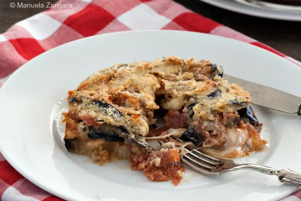 A serving of the eggplant bake on a white plate.