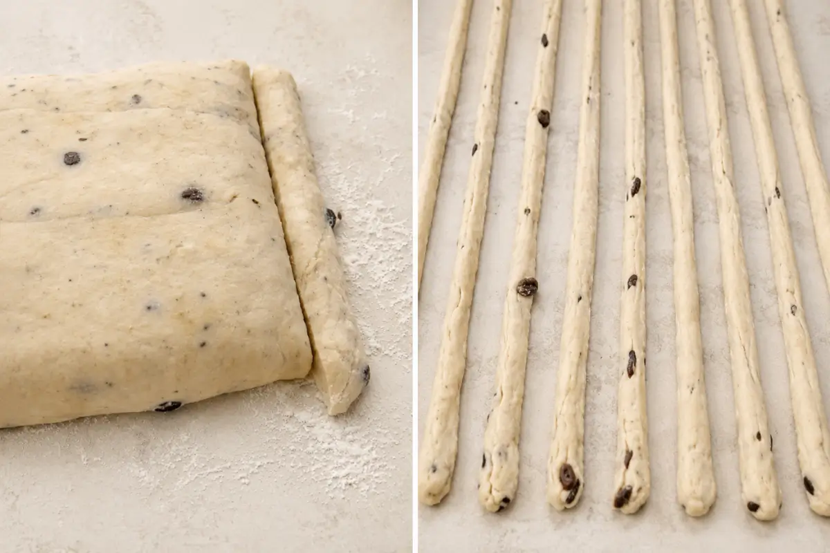 Dough cut into strips and gently pulled into long breadsticks on baking paper.