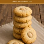 Stack of Almond Shortbread Cookies with whole almond toppings.