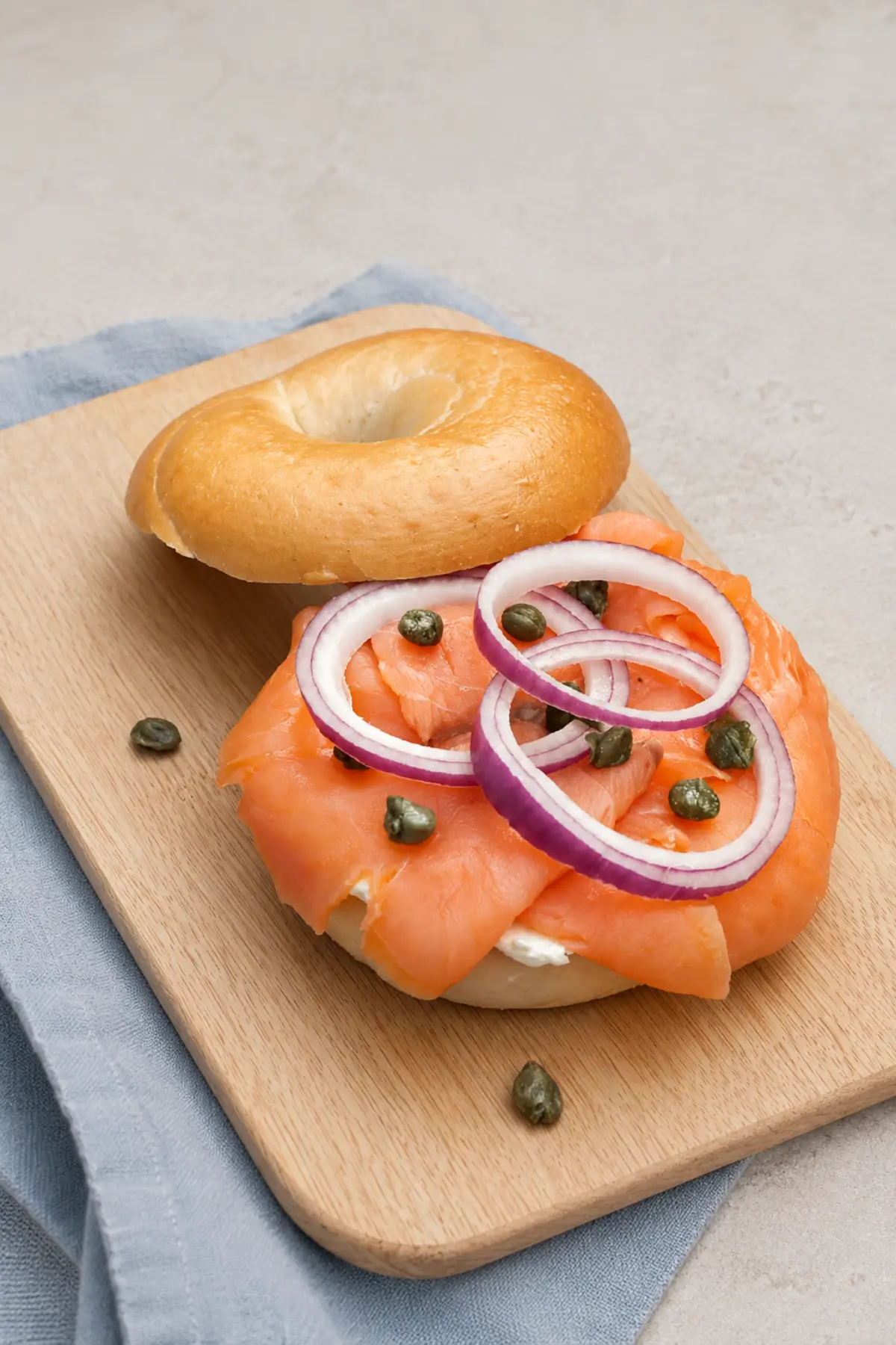Smoked salmon layered over cream cheese with sliced red onion and capers.