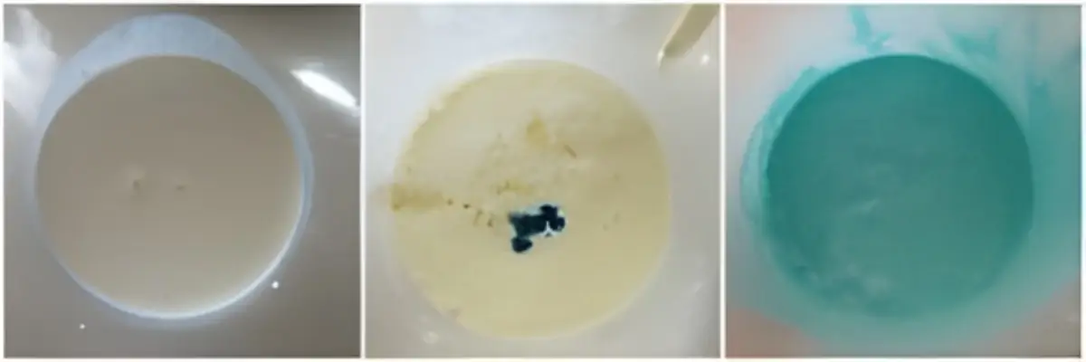 Milk, cream, sugar, and blue food colour blended in a bowl.