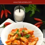 Bowl of cicatelli pasta with arrabbiata sauce.