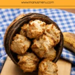 Golden brown banana coconut treats displayed in a coconut shell with a ripe banana in the background.