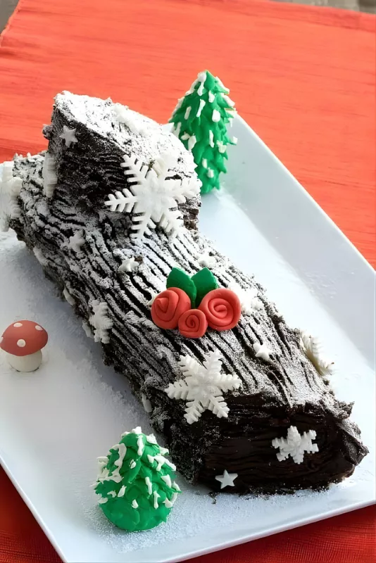 A festive Christmas dessert made with Genoise sponge and chocolate ganache.