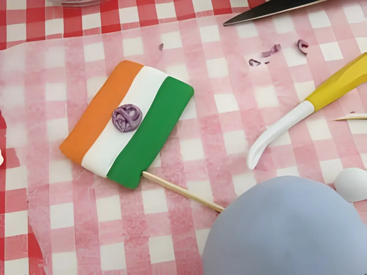 Fondant Indian flag with orange, white, and green stripes and a small purple Ashoka Chakra.