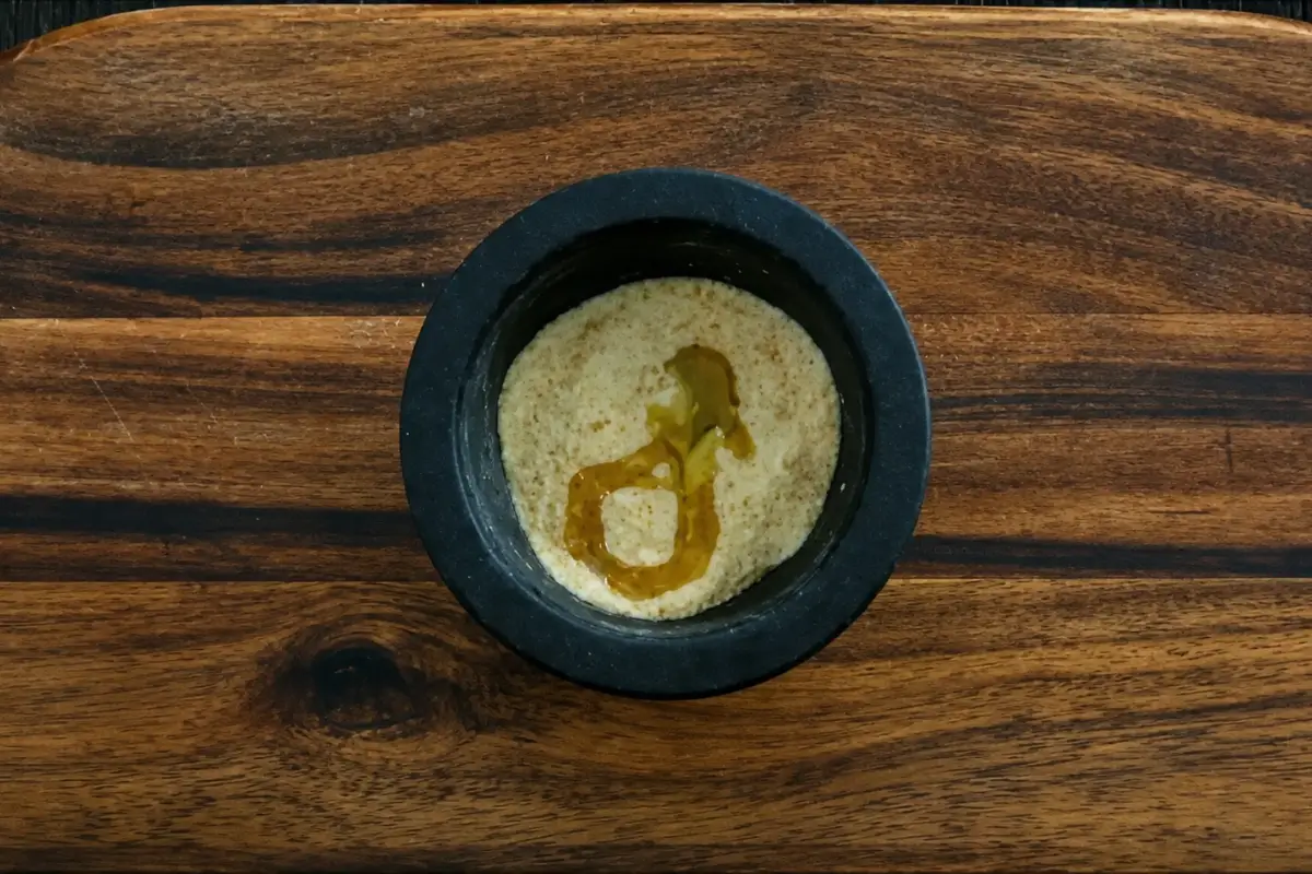 Garlic breadcrumbs mixed with olive oil in a mortar and pestle for a crunchy pasta topping.