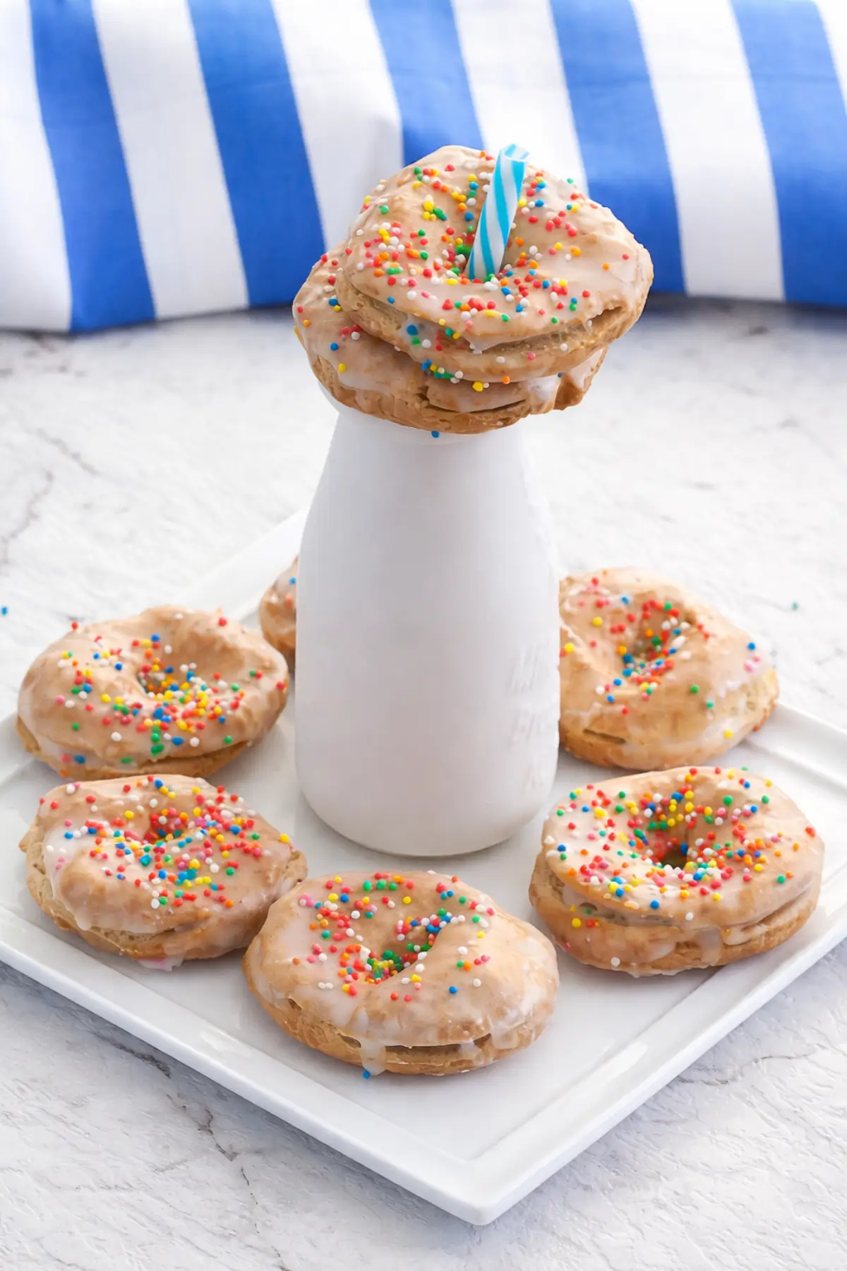 Italian Easter cookies stacked and served with milk.
