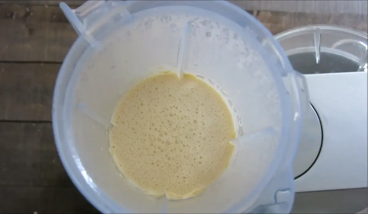 Smooth custard batter inside a blender jug after mixing.