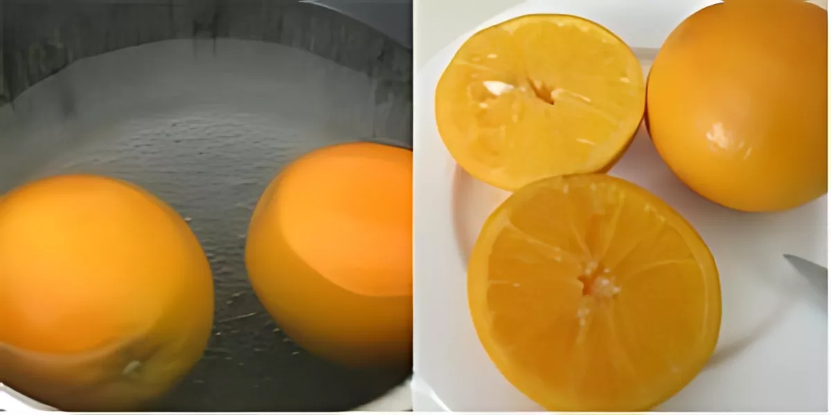 Whole oranges simmering in water, then halved and cooled, ready for orange polenta cake with Grand Marnier.