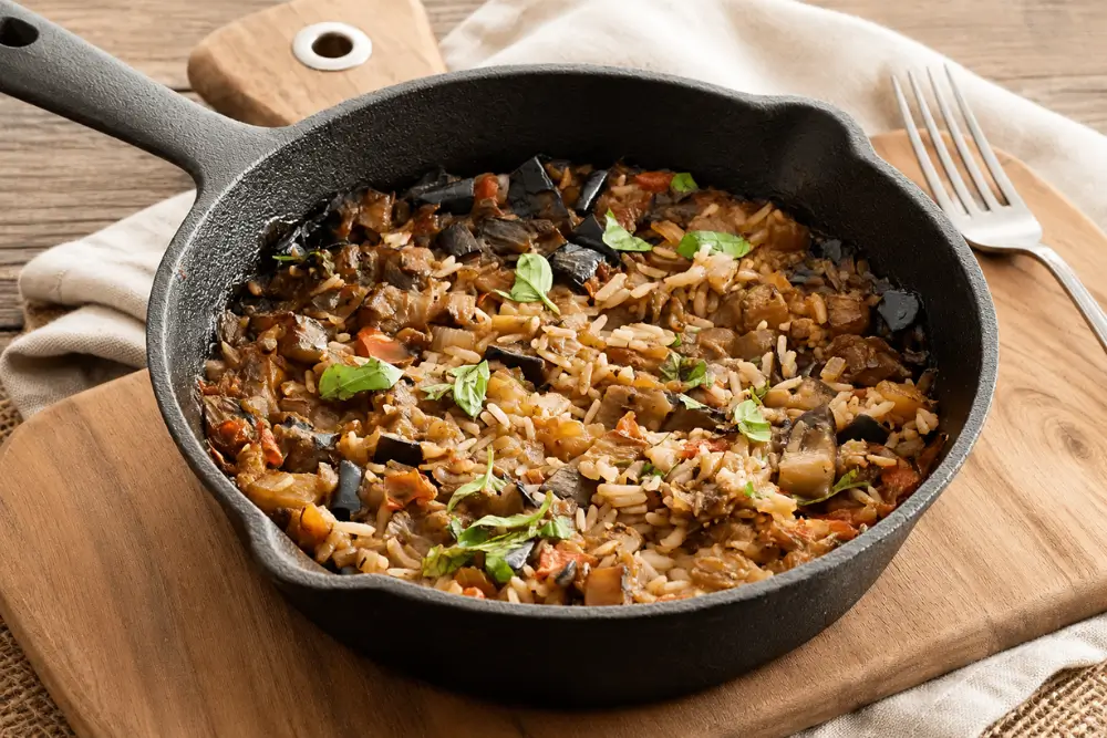 One-Pot Mediterranean Eggplant Rice served in a cast-iron skillet.