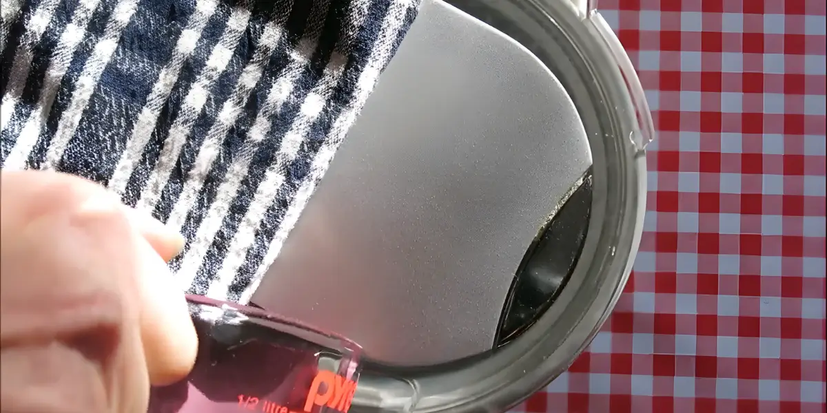 Pouring the Malbec ice cream mixture into the churner.