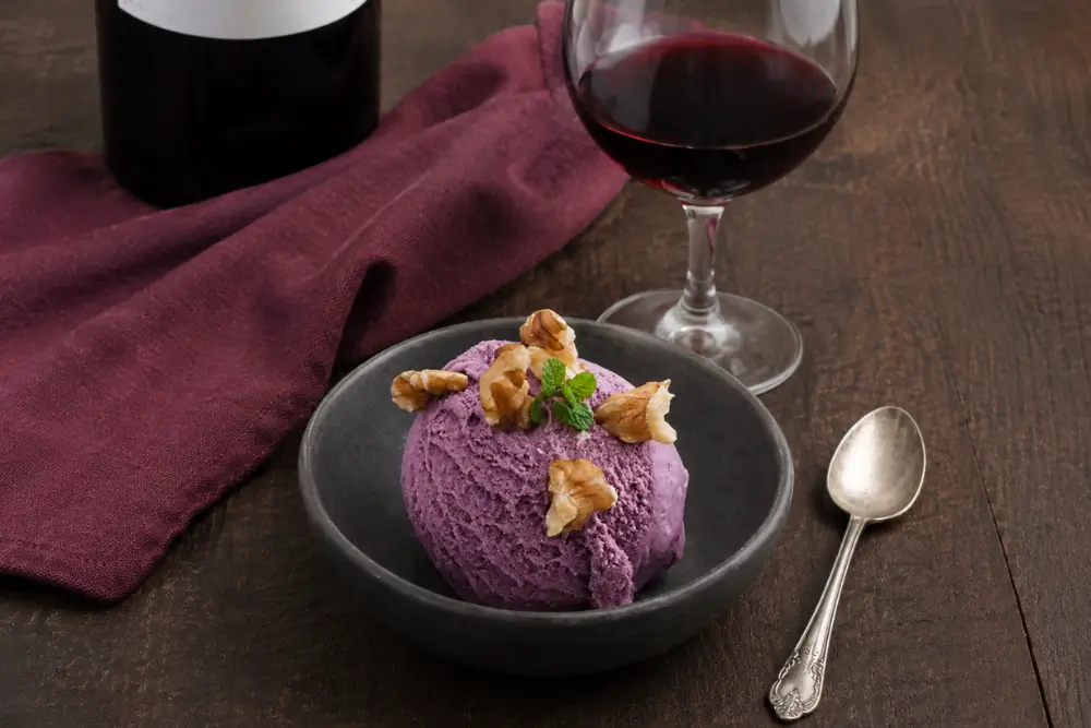 Creamy scoop of wine-flavoured ice cream finished with walnuts and fresh mint.