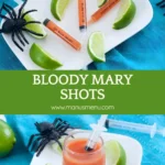Syringes filled with Bloody Mary on a plate with lime wedges.