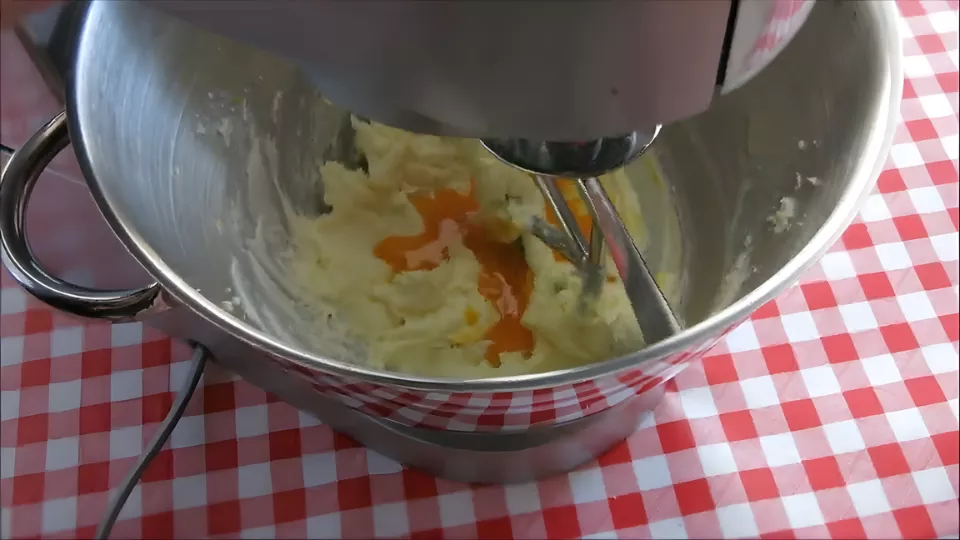 Egg yolks added to the creamed mixture and blended until smooth.